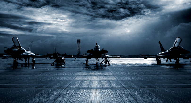 Three RAF Typhoon aircraft on ground at air station