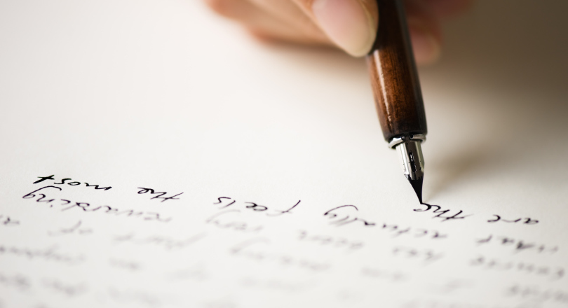 A pen writing a letter
