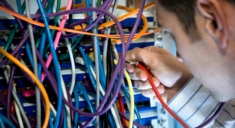 Man working with network cables