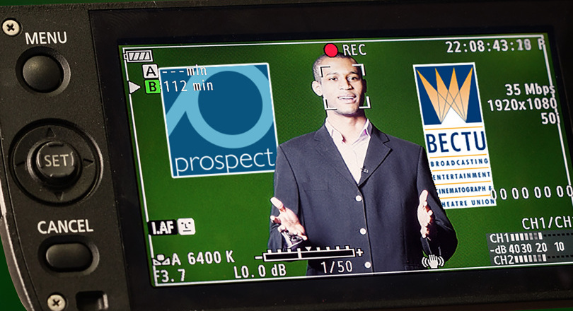 member stood in front of a camera with BECTU and Prospect Logos